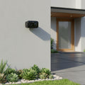 TP-Link Tapo C401 wire-free outdoor security camera mounted on house exterior wall