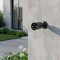 TP-Link Tapo C411 battery powered outdoor security camera mounted on house exterior wall