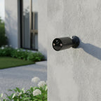 TP-Link Tapo C411 battery powered outdoor security camera mounted on house exterior wall