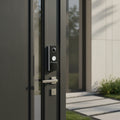 TP-Link Tapo D235 video doorbell camera installed on modern home entrance door