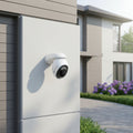 TP-Link Tapo C560WS 4K outdoor pan tilt security camera installed on house exterior wall