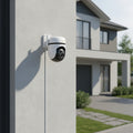 TP-Link Tapo C530WS outdoor pan tilt security camera installed on house exterior wall