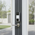 TP-Link Tapo D210 video doorbell camera installed on modern home entrance door