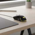 ASUS TUF Gaming M3 Gen II mouse placed on a clean desk in a realistic minimal workspace setting.