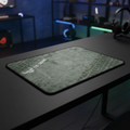 ASUS TUF Gaming P3 cloth mouse pad on a premium gaming desk with a modern RGB gaming room background.