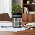 Casio DJ-220D PLUS check desk calculator on a professional accounting desk.