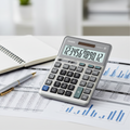 Casio DM-1200FM desk calculator on accounting workspace.