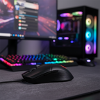 MSI GM41 lightweight gaming mouse centered on desk with blurred RGB gaming setup.