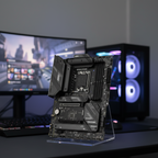 MSI B760 motherboard standing upright on a gaming desk with blurred RGB setup in background.