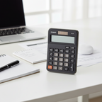 Casio MX-8B mini desk calculator on a modern office desk.