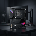 ASUS ROG Maximus XII Hero Wi-Fi motherboard standing upright on a gaming desk in a real workspace.