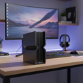 TP-Link Archer BE700 Wi-Fi 7 router on a premium desk with a blurred modern gaming office.