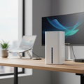 TP-Link Archer NX200 5G Wi-Fi 6 router on a modern office desk with a blurred workspace background.