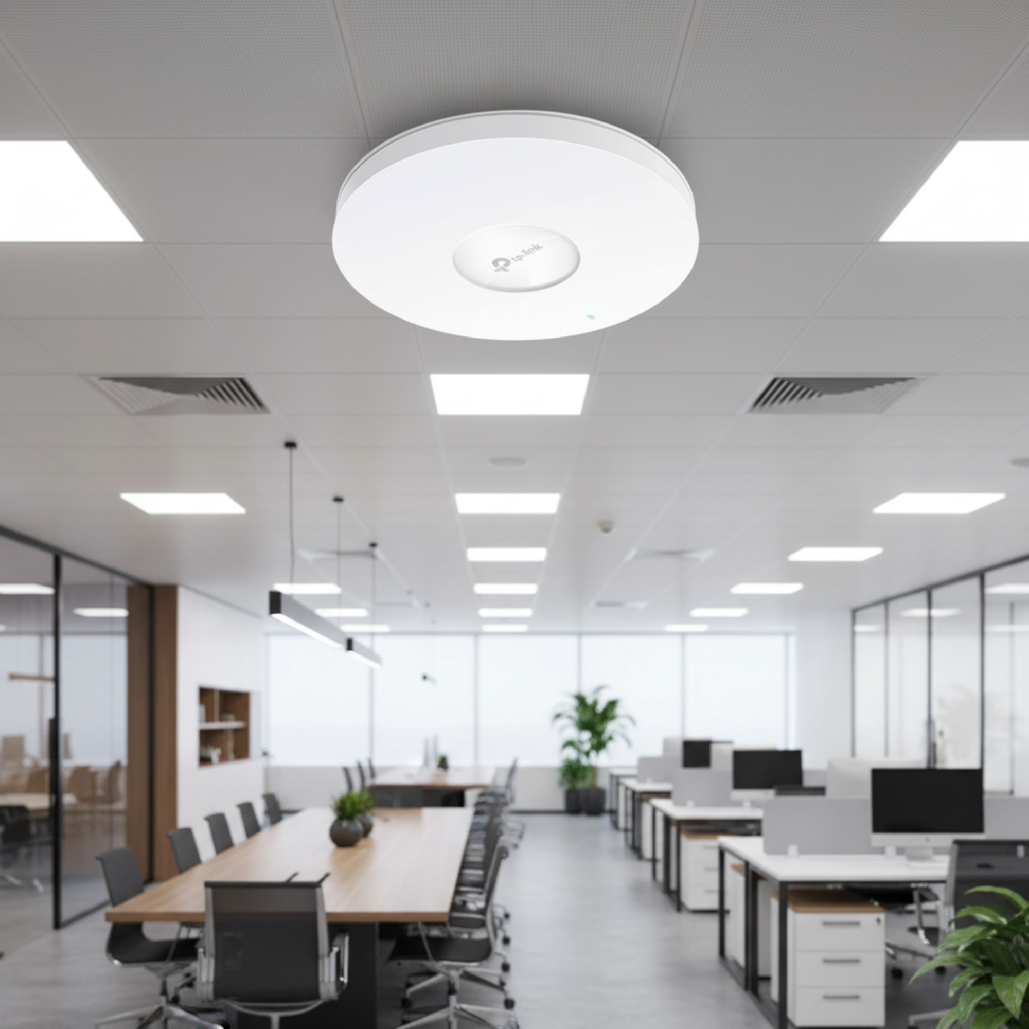 TP-Link EAP610 ceiling-mounted in a modern office with blurred business interior.
