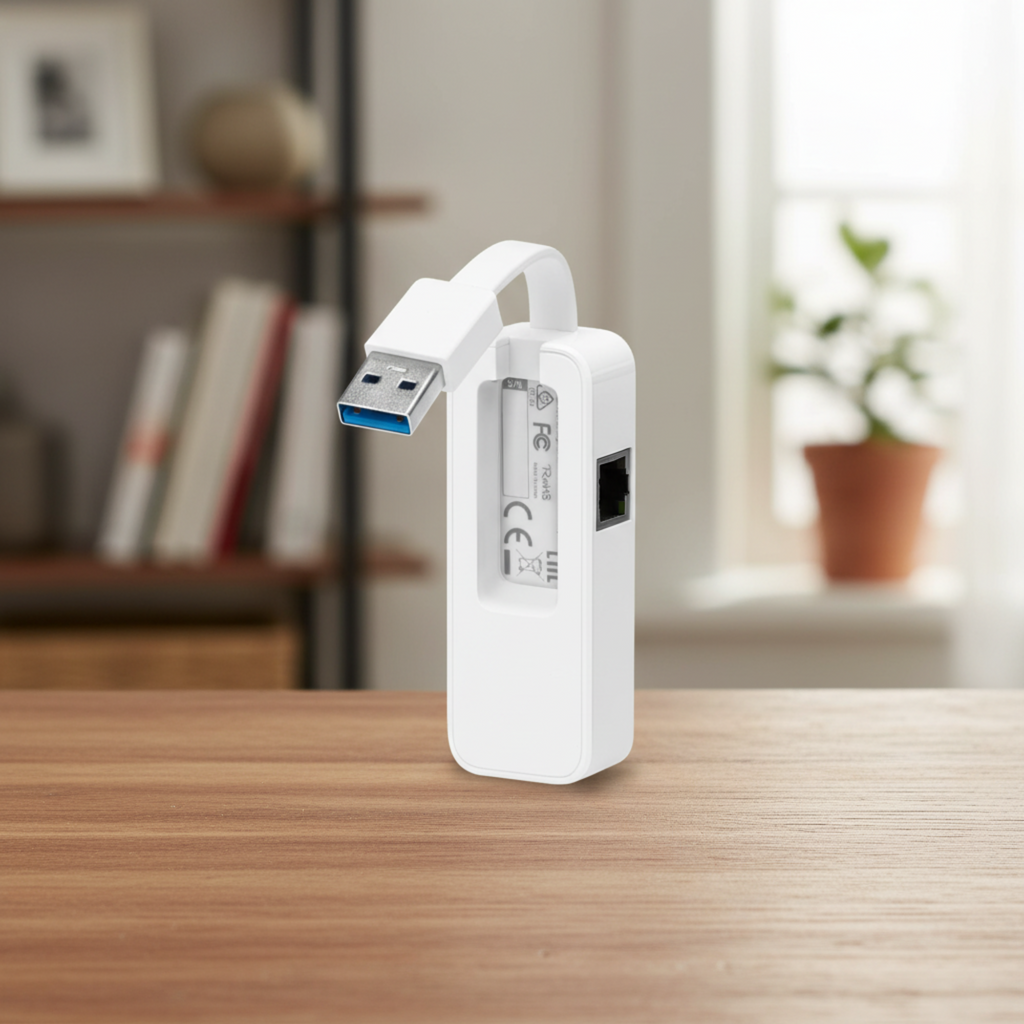 TP-Link UE300 USB 3.0 Ethernet adapter on a real indoor surface.