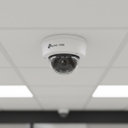 TP-Link VIGI C220I dome camera installed on a retail store ceiling for surveillance monitoring.