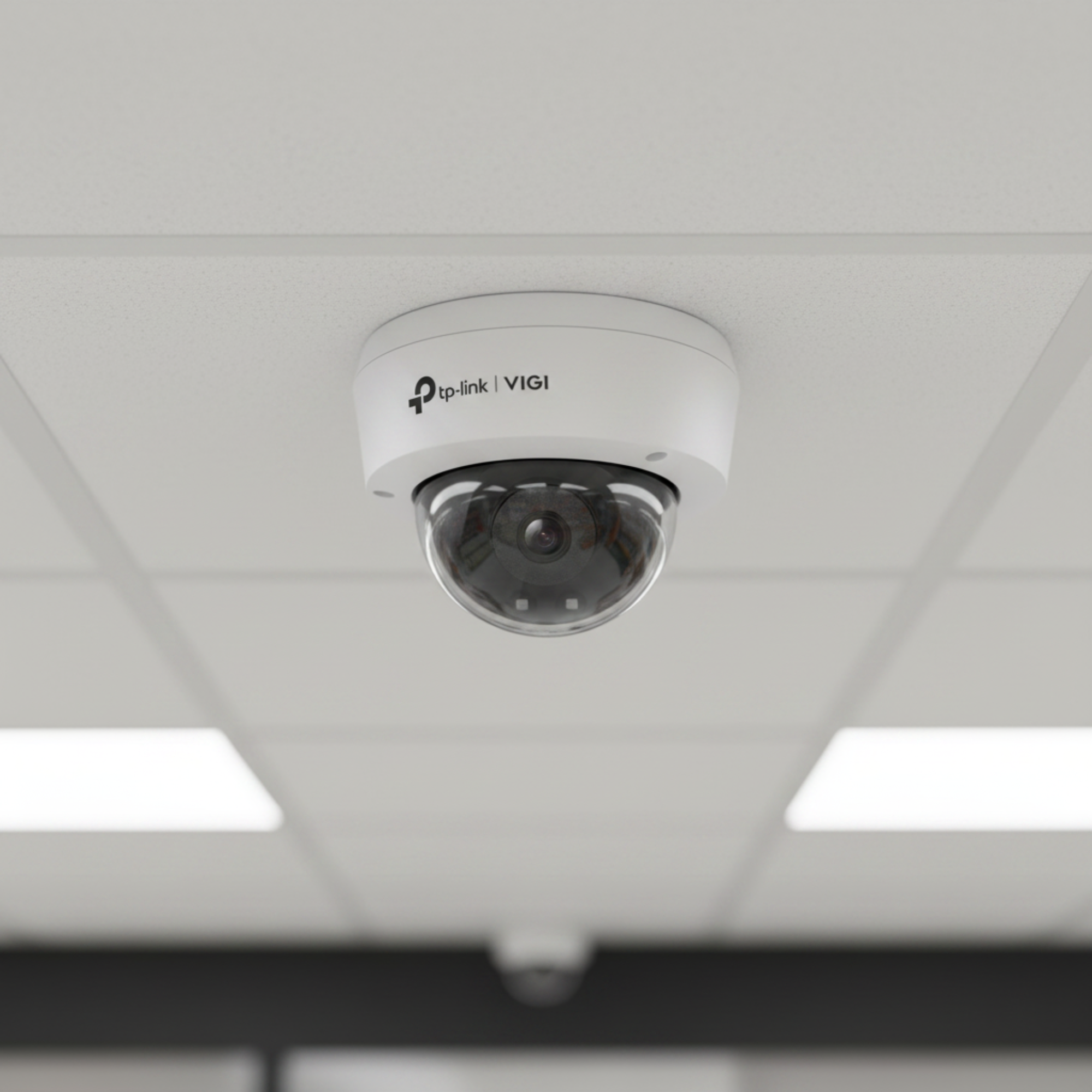 TP-Link VIGI C220I dome camera installed on a retail store ceiling for surveillance monitoring.