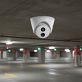 TP-Link VIGI C420I turret camera installed in a parking area for night surveillance monitoring.