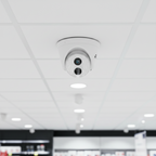 TP-Link VIGI C430I turret camera mounted in a retail store ceiling for aisle surveillance.