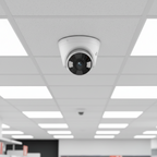 TP-Link VIGI C430 turret camera mounted on retail store ceiling for aisle monitoring.