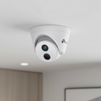 TP-Link VIGI C440I turret camera installed on office ceiling corner for workplace surveillance.